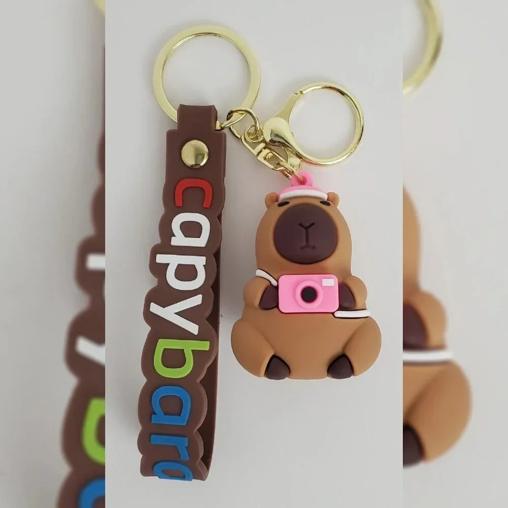 NWT CAPYBARA KEY CHAIN DIFFERENT ACTIONS 3D LOGO